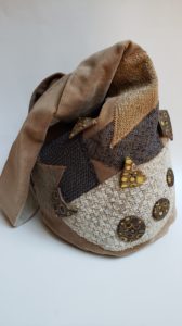Japanese knot bag decorated with polymer clay buttons