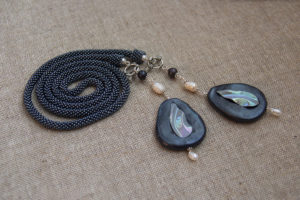 Bead crochet lariat with polymer clay end beads