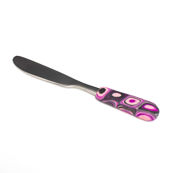 Spreader – butter knife in pink, black, and purple