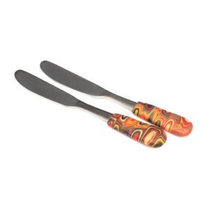 Spreaders – butter knives in gold, red, and black