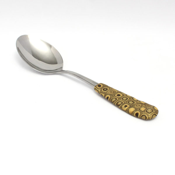 Gold serving spoon