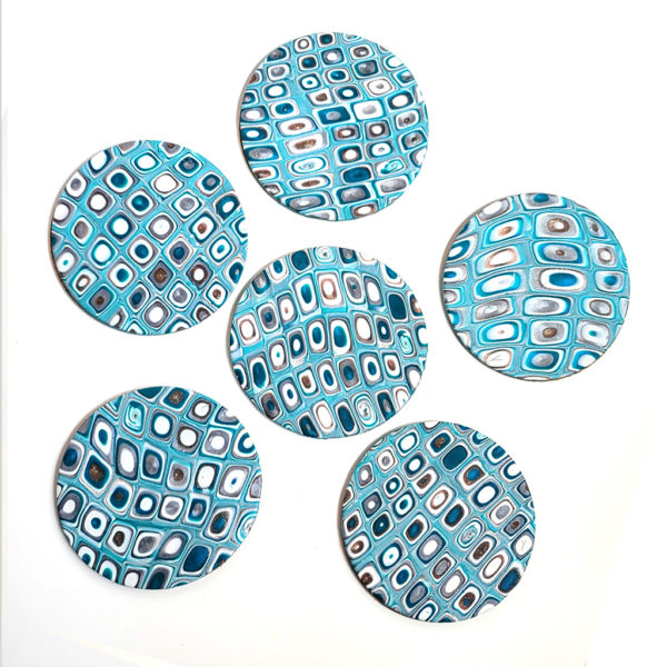 Intense teal, gold, and silver coasters