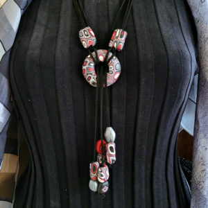 Loop through necklace in red, white, silver, and black