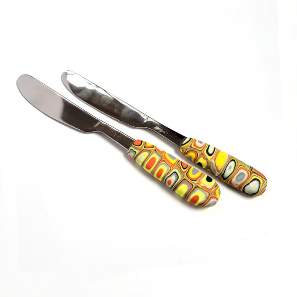 Yellow and orange spreader butter knife